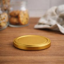 58 plechových viečok - zlatých