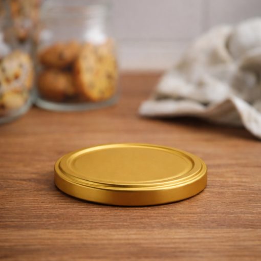 58 plechových viečok - zlatých