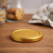 63 plechových viečok - zlatých