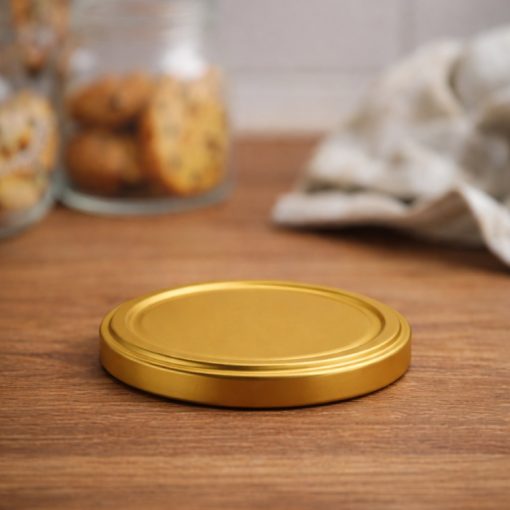 63 plechových viečok - zlatých