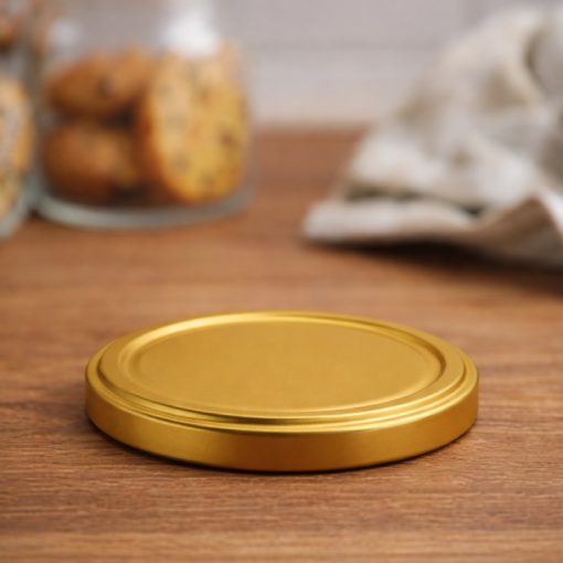 89 plechových viečok - zlatých