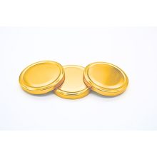 89 plechových viečok - zlatých